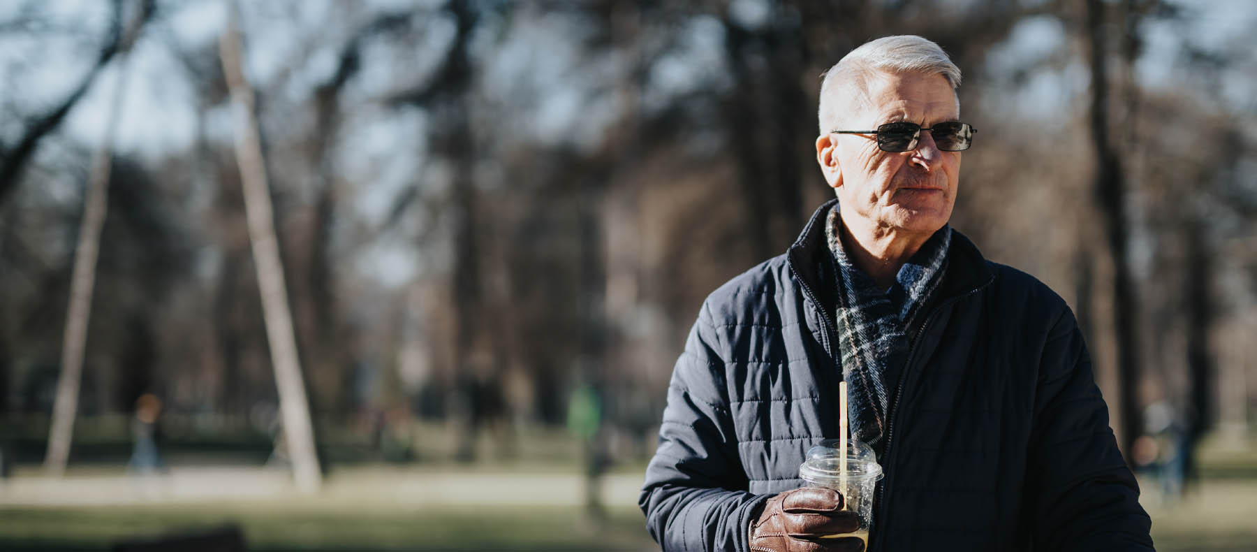 An Elderly Man Walks Confidently Down the Street