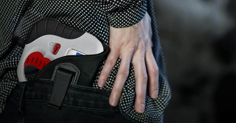 Close up of a hand reaching for a holstered HERO® 2020